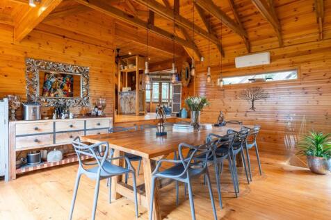 View of dining room toward kitchen beyond