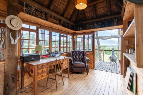 Interior tree house study and verandah beyond
