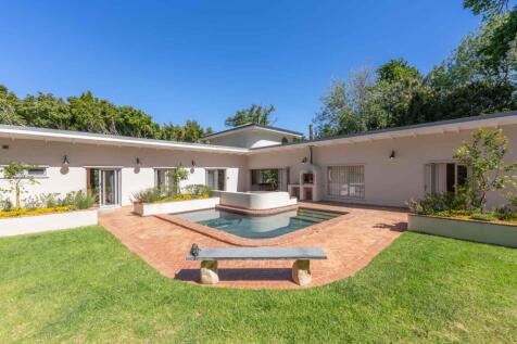 Pool, lawn, and braai area