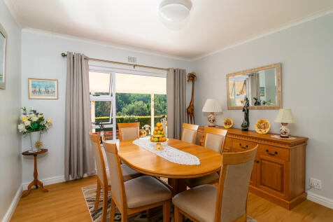 Separate dining room with laminate floor