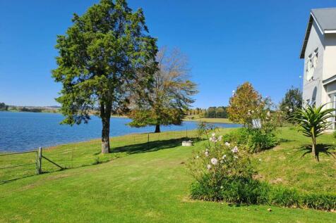 garden rolls down to the dam