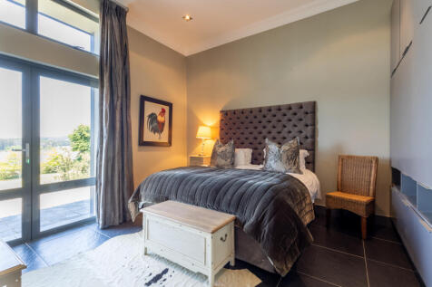 Bedroom with doors to the patio  views