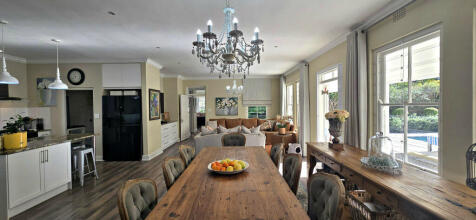 DINING AREA WITH DOOR OPEN TO ENTERTAINMENT AREA