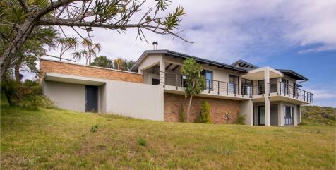 Back of house with storage area for the pool
