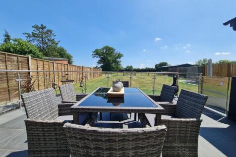 Decking, garden and view towards paddock