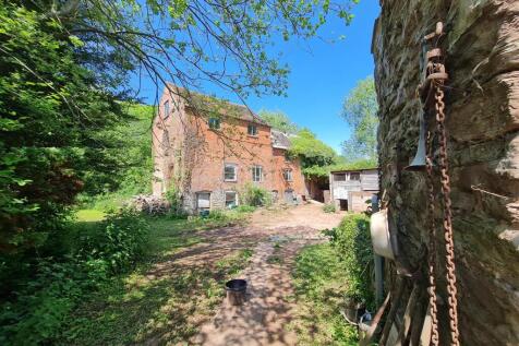 Mill building from garden gate 2.jpg