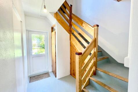 Stairs/to flat and door out to garden
