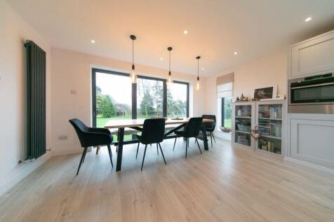 Dining area with bi fold door to priv...