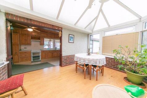 Sun lounge and kitchen