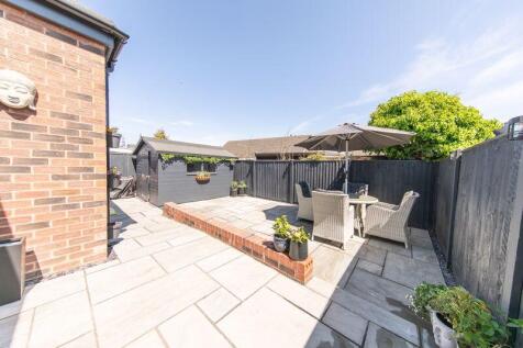 Neatly landscaped low maintenance pri...