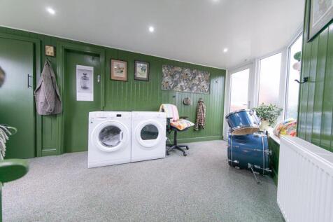 Side porch and utilities room