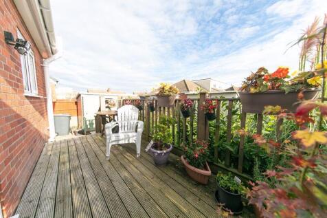 Raised sun deck to house