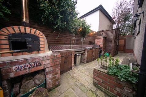 Outdoor kitchen with pizza oven, smok...
