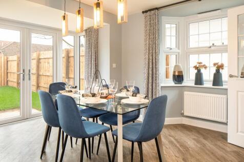 Dining area with bay window, French doors and dining table