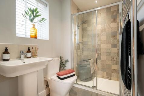 Two bedrooms boast en-suite shower rooms