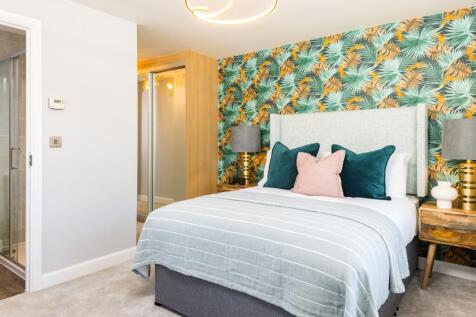 Main bedroom with green and yellow wallpaper