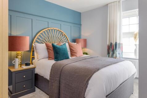 Double bedroom with wall panelling