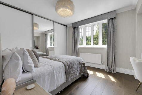 Double bedroom with slider wardrobe and built in dressing ta
