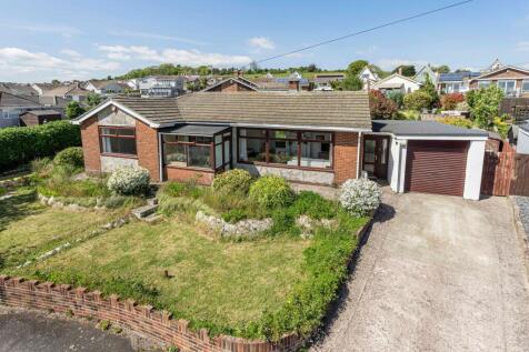 Front of property with elevated rear garden behind