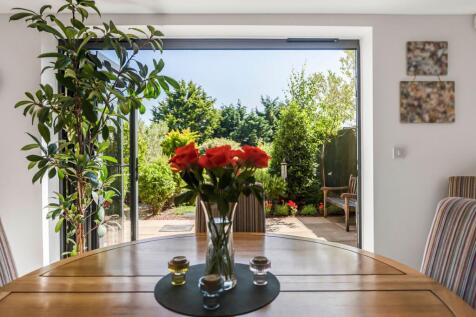 Door from kitchen into gardens