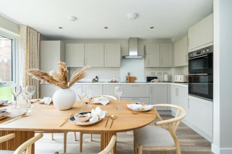 Step into the kitchen where light emanates from french doors
