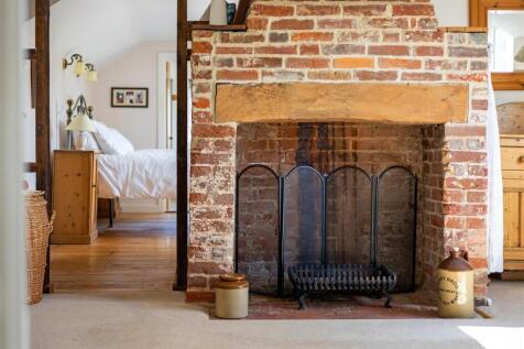 Fireplace in Bed 4 through to Principal Bedroom