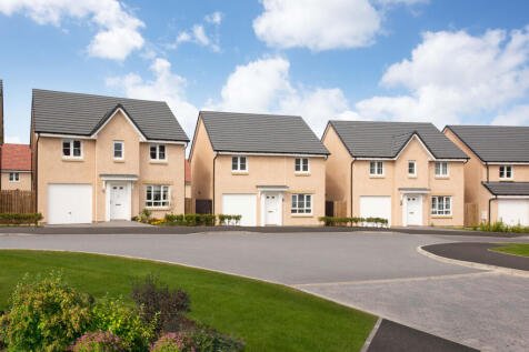Street scene of detached homes with garages