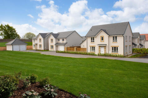Street scene showing green space and detached homes