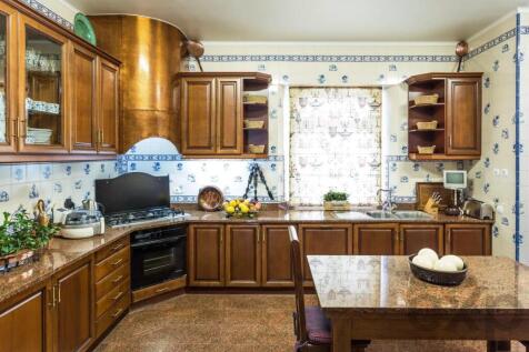 Classic kitchen with wooden cupboards, granite wor
