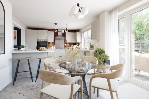 A modern kitchen and dining area with French doors to the rear garden
