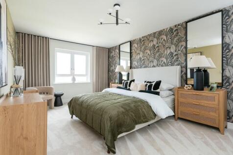 Bedroom 1 stretches across the whole depth of the house