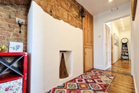 Hallway with exposed brick feature wall