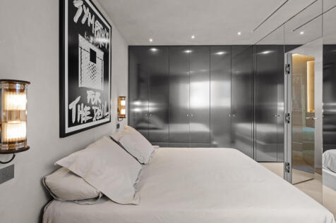 Titanium dressed wardrobes in master bedroom