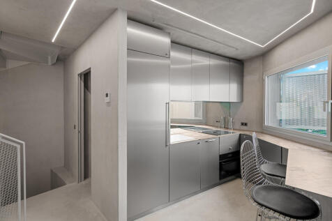 Sophisticated pantry kitchen with hallway amd access to sparated guest bathroom and bedroom (left)