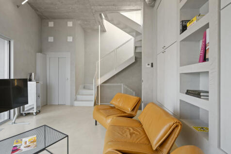 Living room with stairways to rooftop