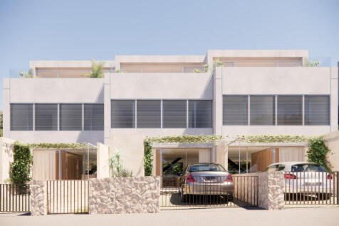 Frontal view of the three terraced houses