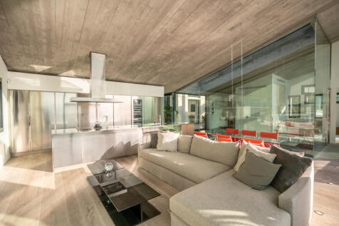 Kitchen-dining-living room with views to the outside and to the master area and pool