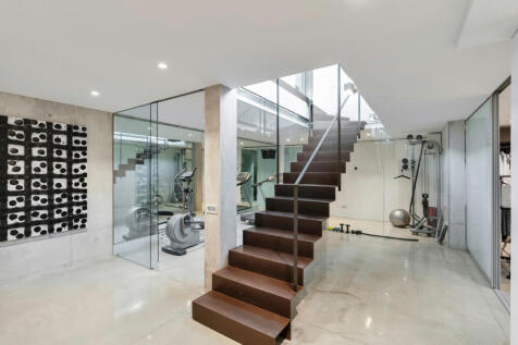 Staircase to the ground floor and gym