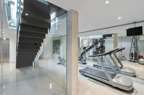 Staircase to the ground floor and gym