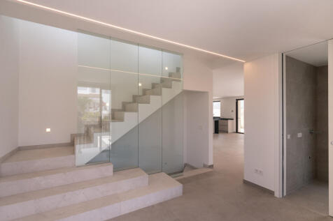 Glazed staircase upstairs and access to underground car park