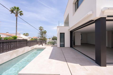 View of the open-plan living/dining/kitchen area from the outdoor pool