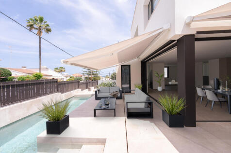 Example of outdoor furniture on terrace with open View of the open-plan living/dining/kitchen area from the outdoor pool