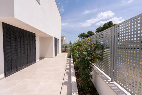 Rear outdoor area with enclosed laundry room
