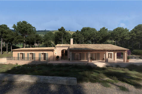 Lateral view of the villa with woodland in the background