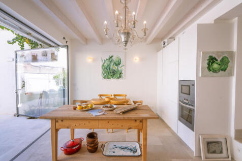 View from the kitchen area to the dining space and pantry on the ground floor