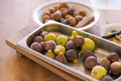 Mediterranean-inspired open kitchen with glass front facing the patio