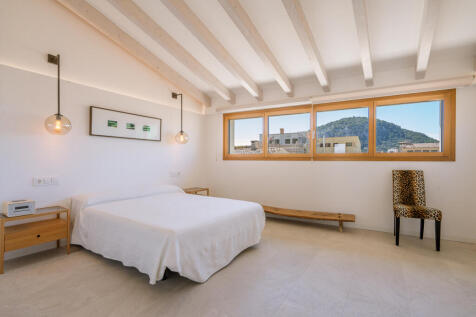 Spacious master bedroom with high sloped ceiling