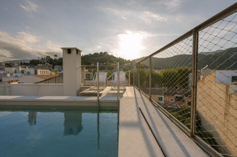 Rooftop terrace with pool and views over Pollença¿s old town and surrounding mountain ranges