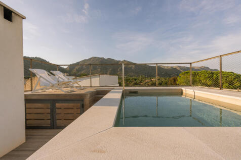 Rooftop terrace with pool and views over Pollença¿s old town and surrounding mountain ranges