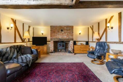 Spacious living room with wood burning stove